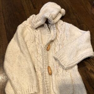 Long hooded sweater with toggle closure sequins